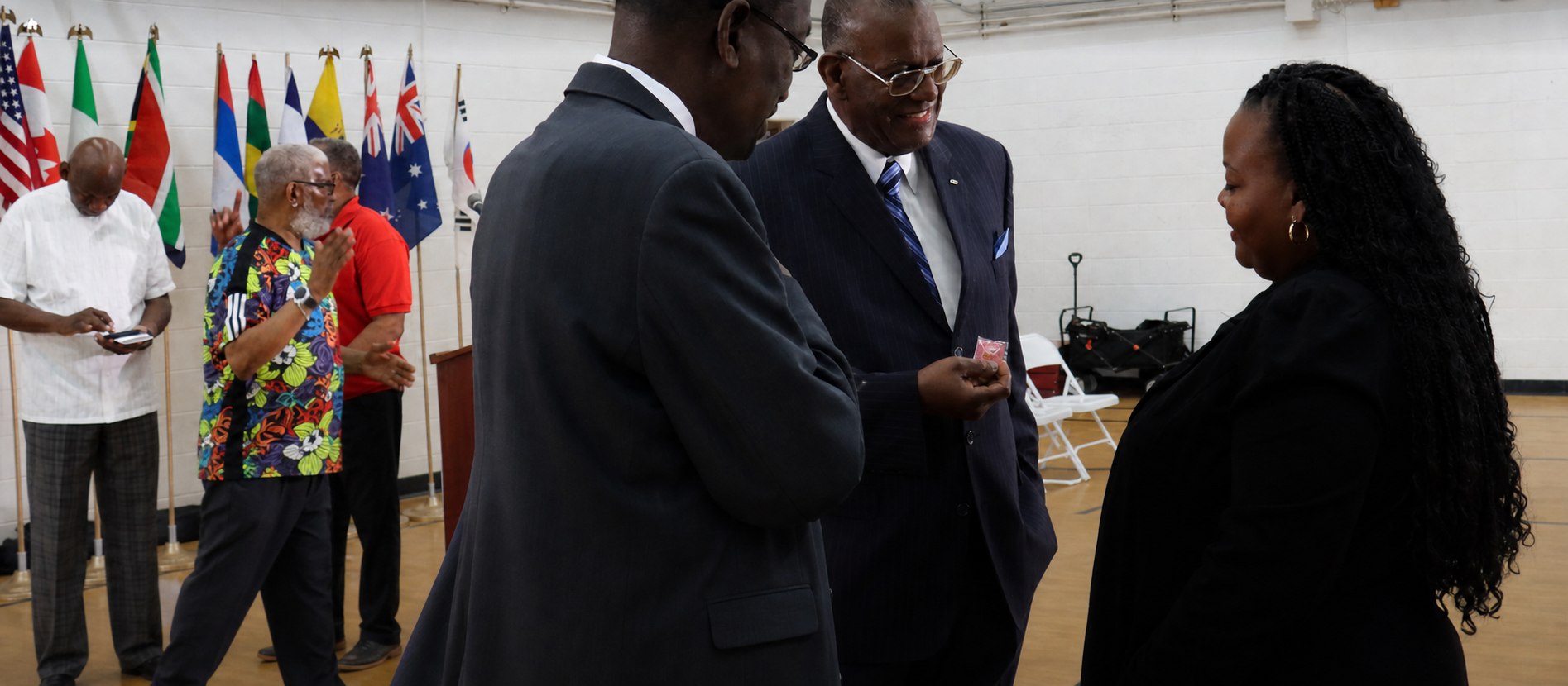CAP leaders in conversation during a community gathering