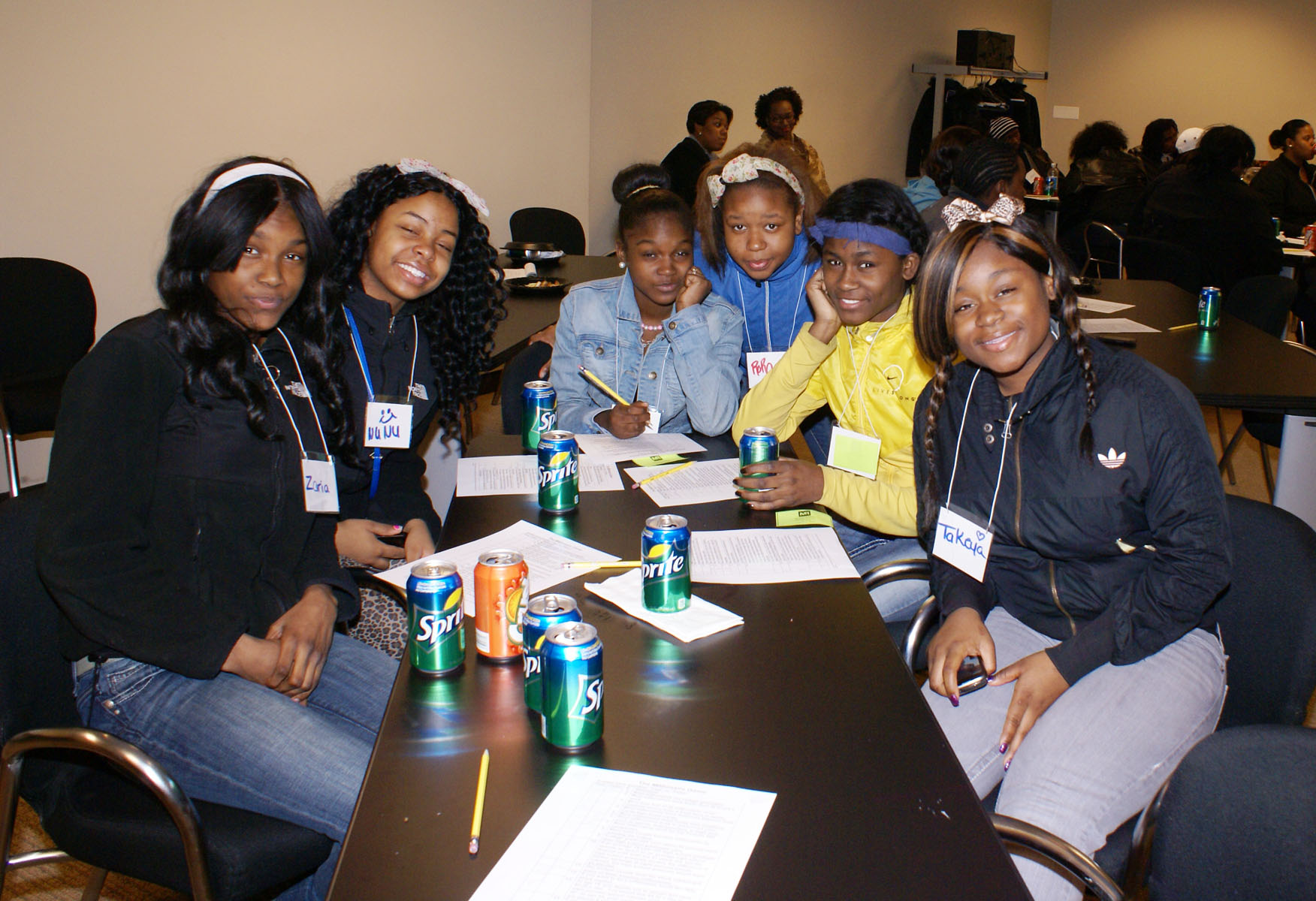 Young people learning together around a table during a CAP youth program
